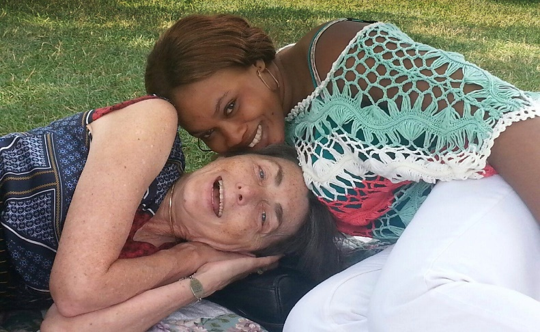 Mariama and My Wife on a blanket on the National Mall in Candid Shot Taken by My Granddaughter